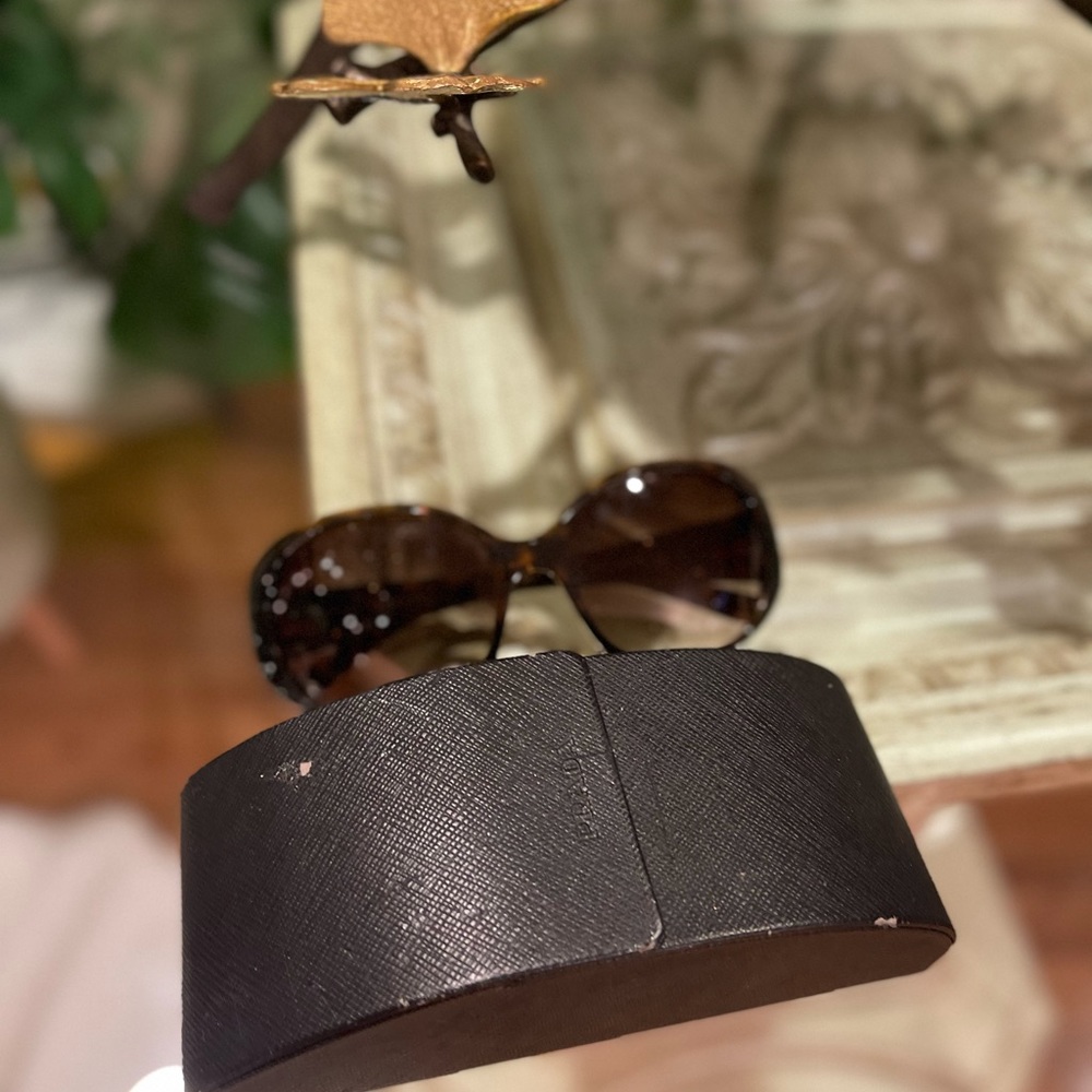 Beautiful brown and gold Prada sunglasses. Worn only a few times.